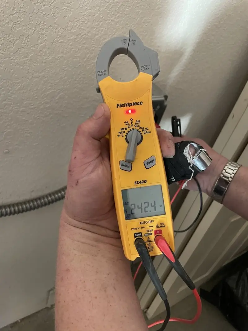 Voltage testing with clamp meter during Generator Installation in Lone Grove
